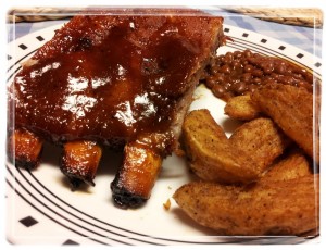 Rural Mom Barbecue Ribs on a Plate with Potato Wedges and Beans