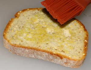 Brushing Millet Chia Bread with EVOO