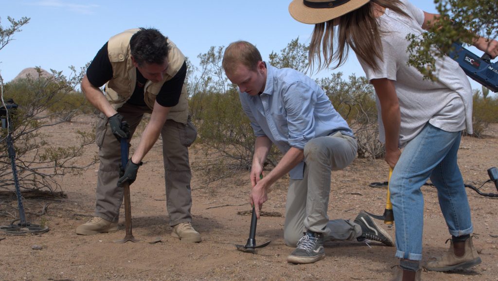 TUCSON, ARIZ.- (Left to Right) Geoff and Charlie uncover a meteorite, as Kirby watches. (Photo credit: National Geographic Channels/Jill Littman)