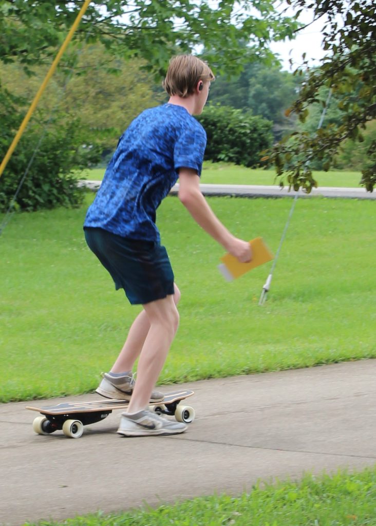 Skullcandy Push True Wireless Earbuds - delivering mail on skateboard